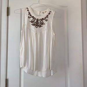 White blouse with copper flowering at the top